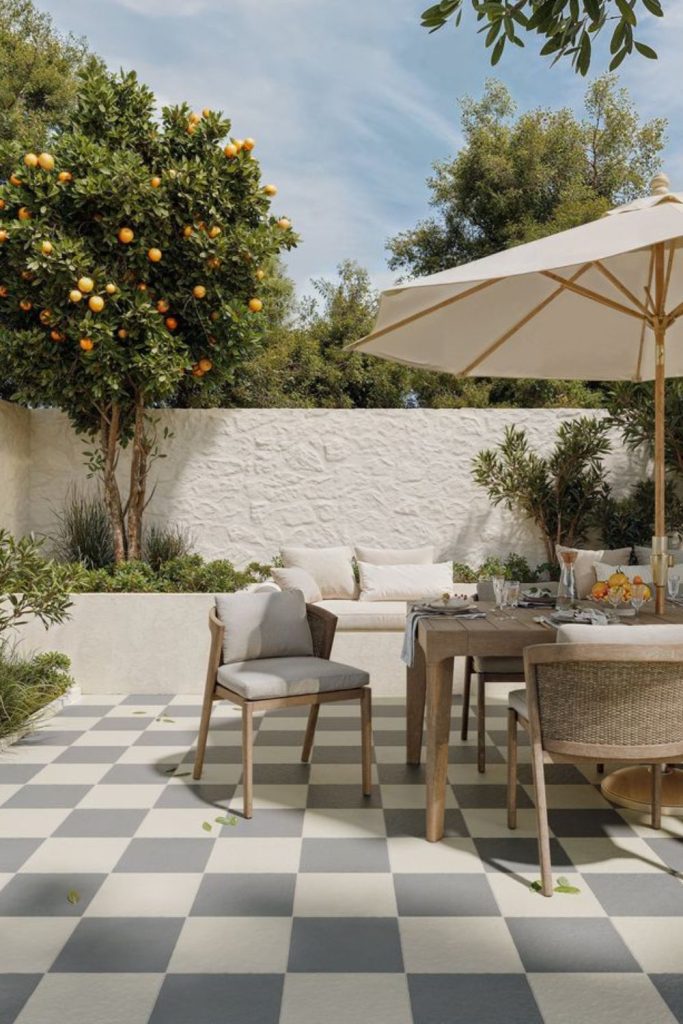 Checkerboard concrete patio outdoor seating.