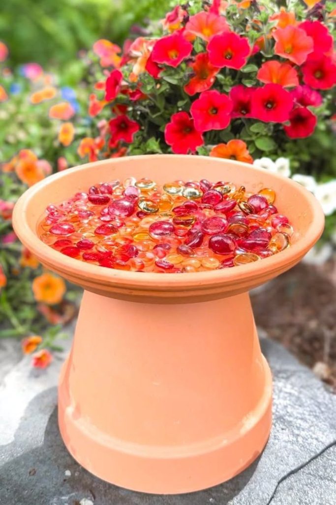 Colorful glass gem bee bath.