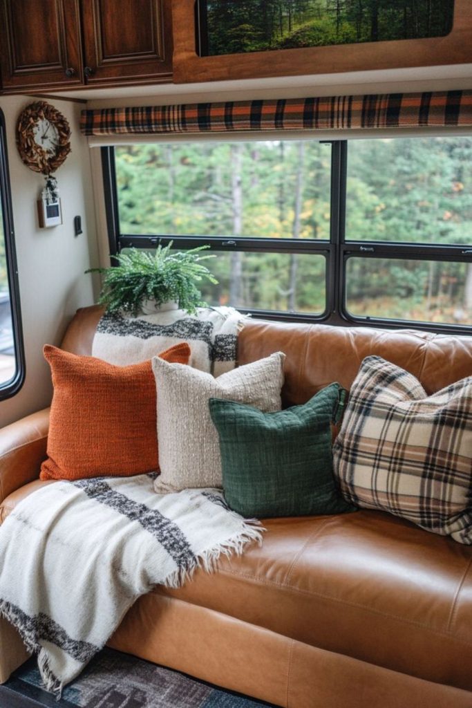 Farmhouse pillows on camper bench.