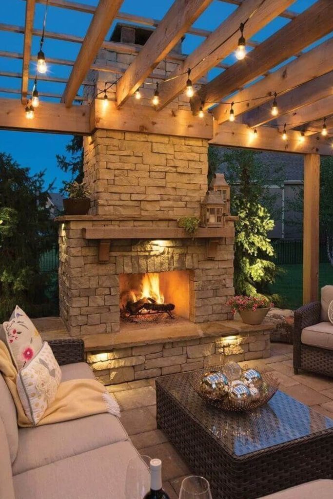 Timber pergola beside cozy firepit.