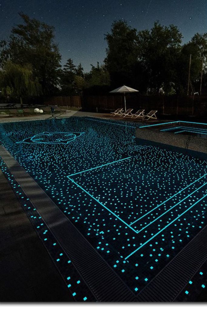 Glowing pool night pebble path