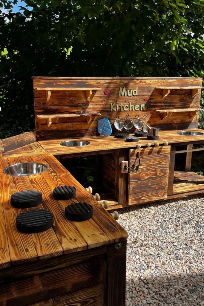 Rustic campfire themed mud kitchen.