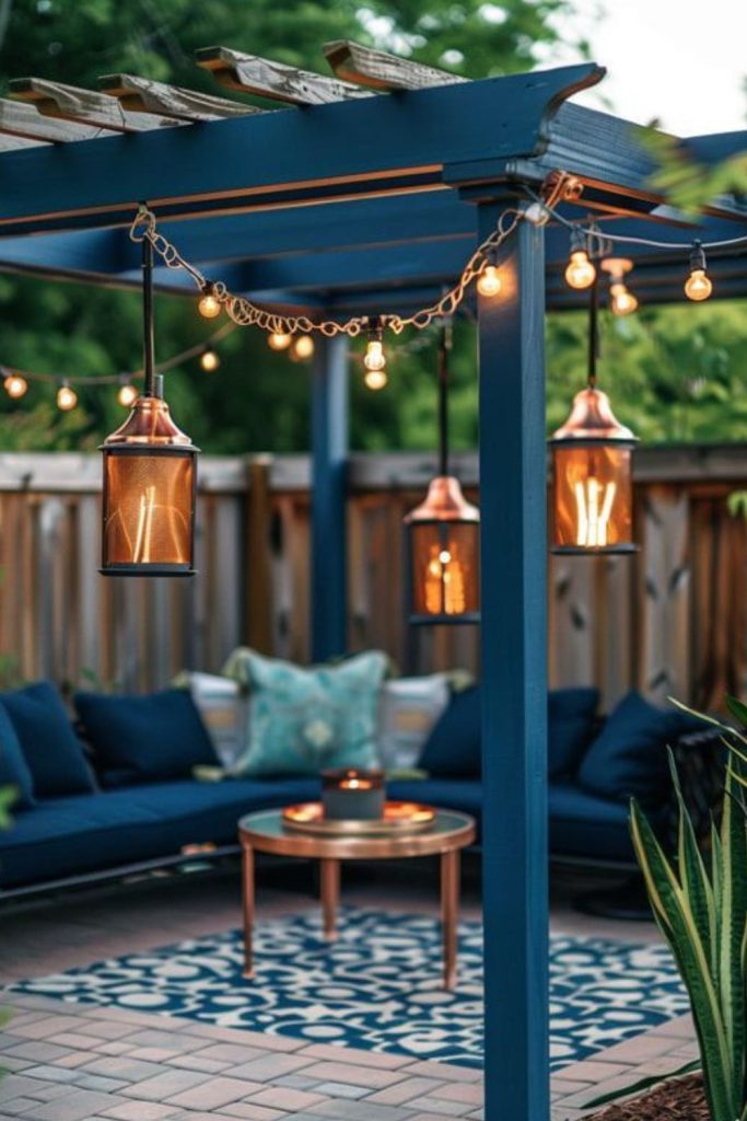 Blue-accent pergola patio at dusk.