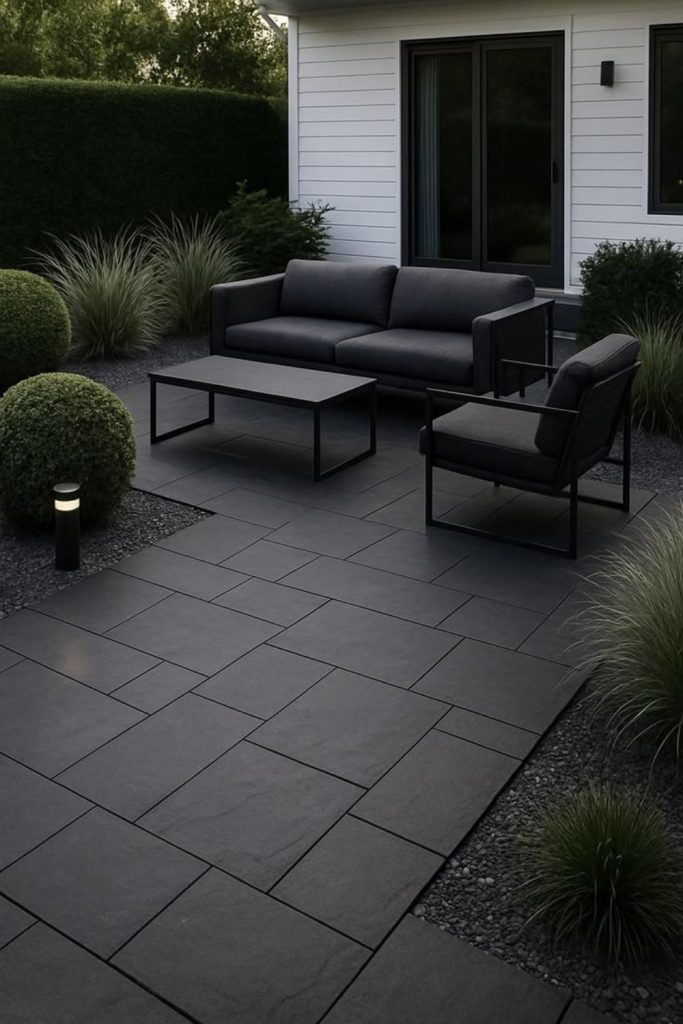 Dark modern concrete patio aesthetic.