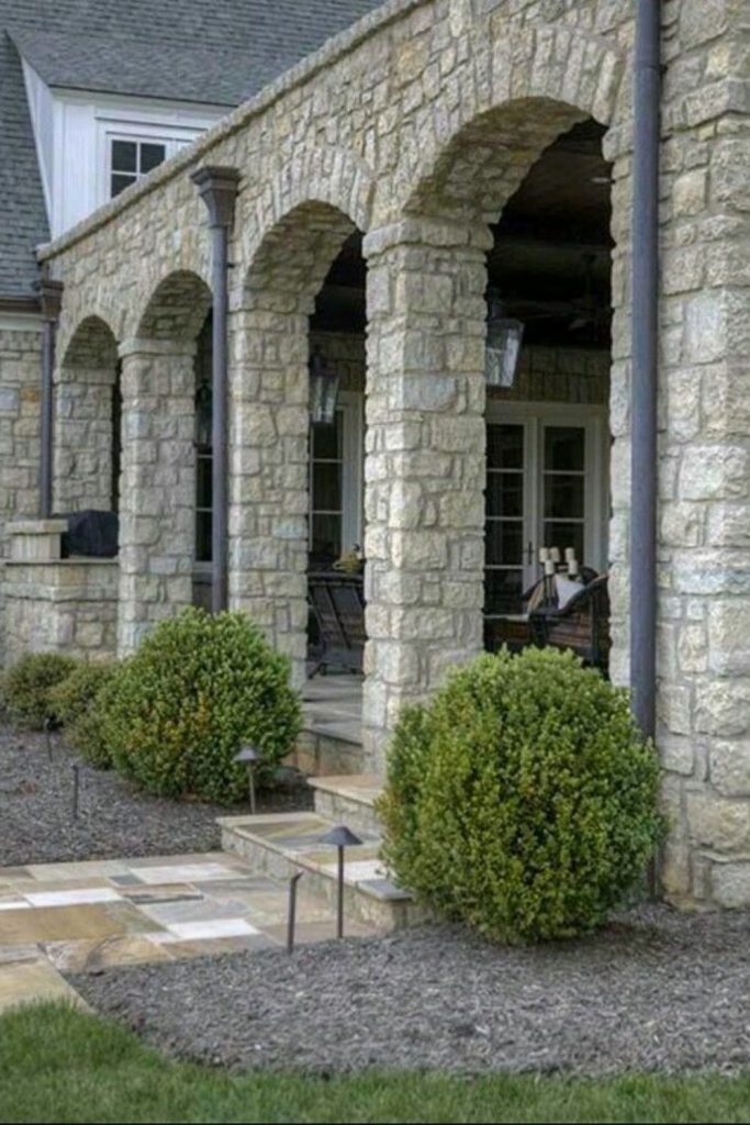 Stone pillar pergola garden retreat.