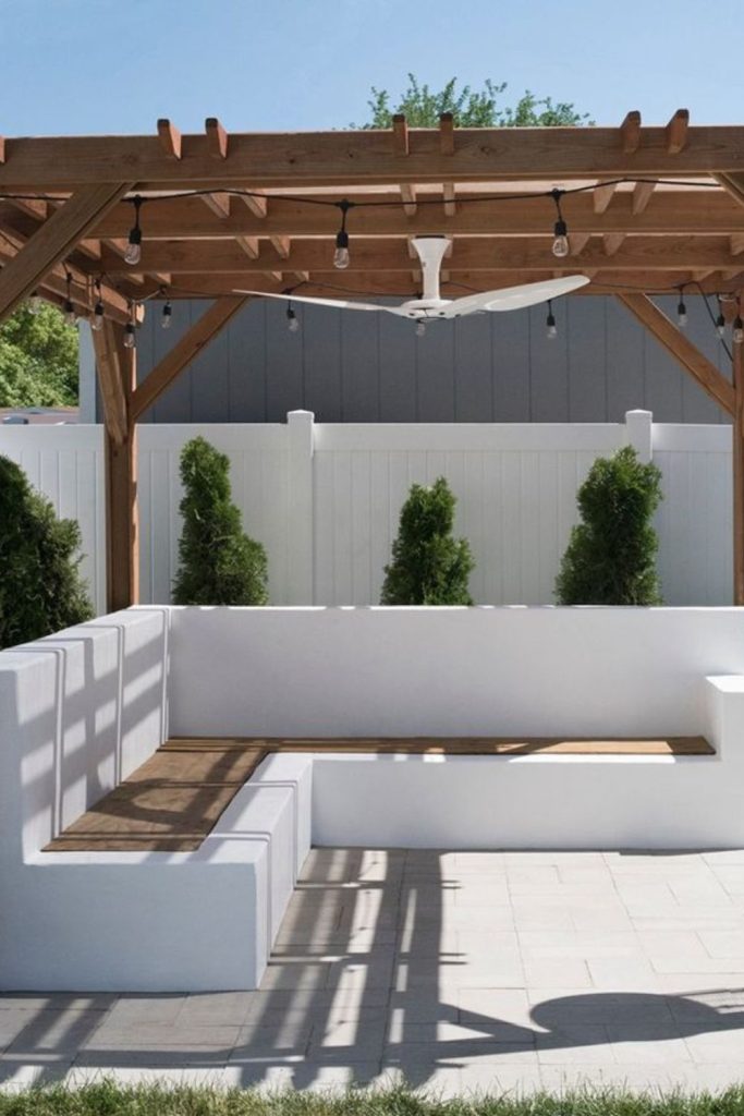 Sunken concrete patio cozy lounge.