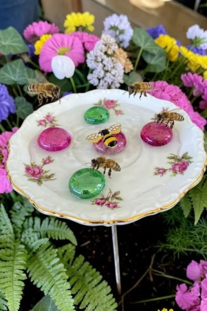 Vintage teacup bee bath display.