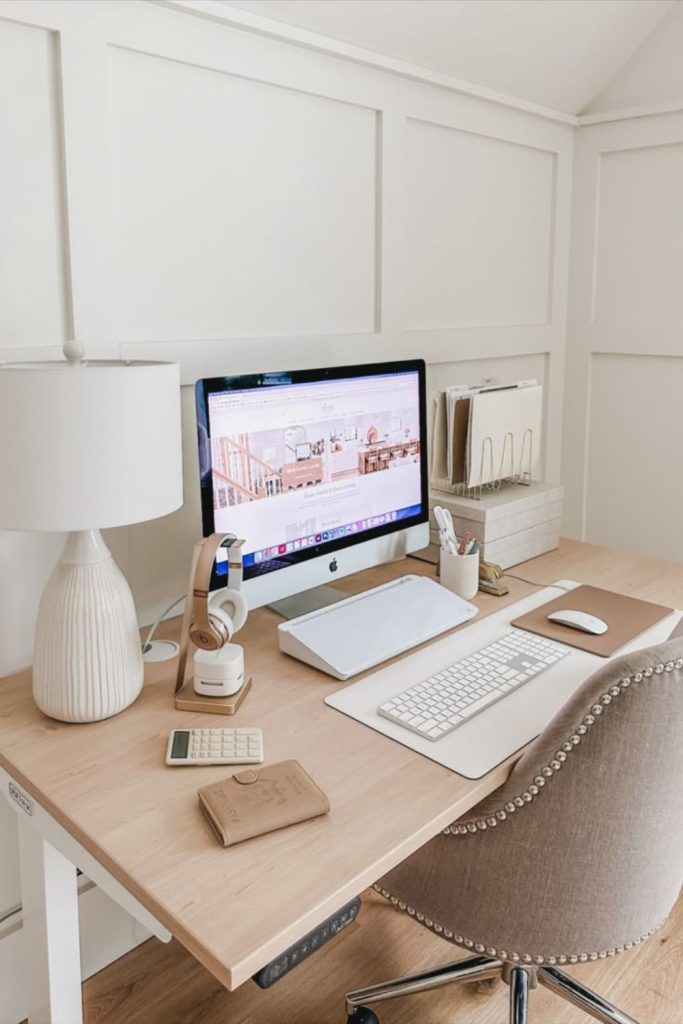 Neutral warm earthy cubicle workspace style.