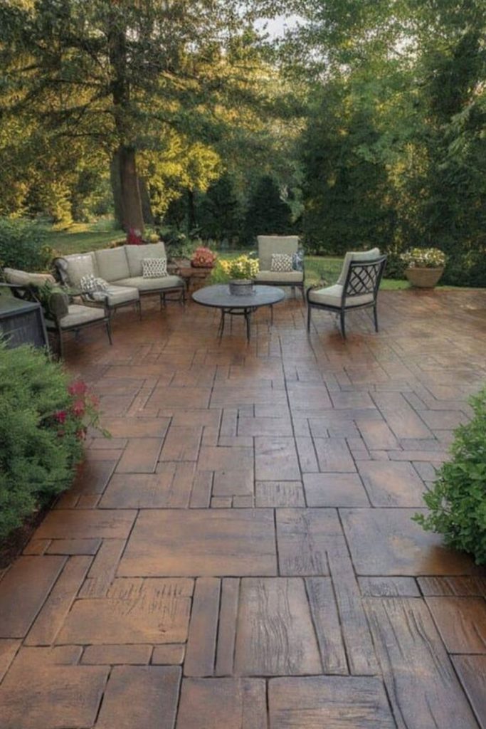Woodland concrete patio beneath trees.