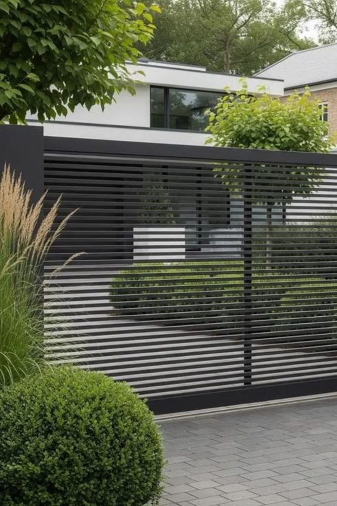 Privacy focused black steel slat gate