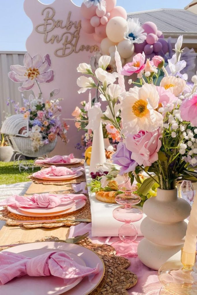 Butterfly floral baby shower backdrop arrangement.