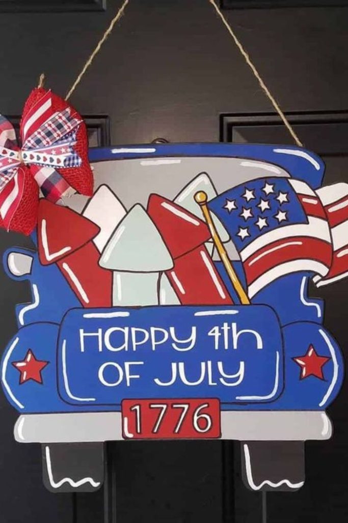 Pickup truck with patriotic decorations.