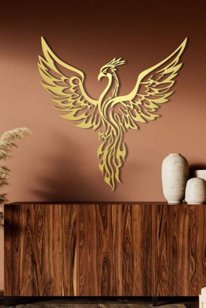 Golden phoenix relief mounted on wall.