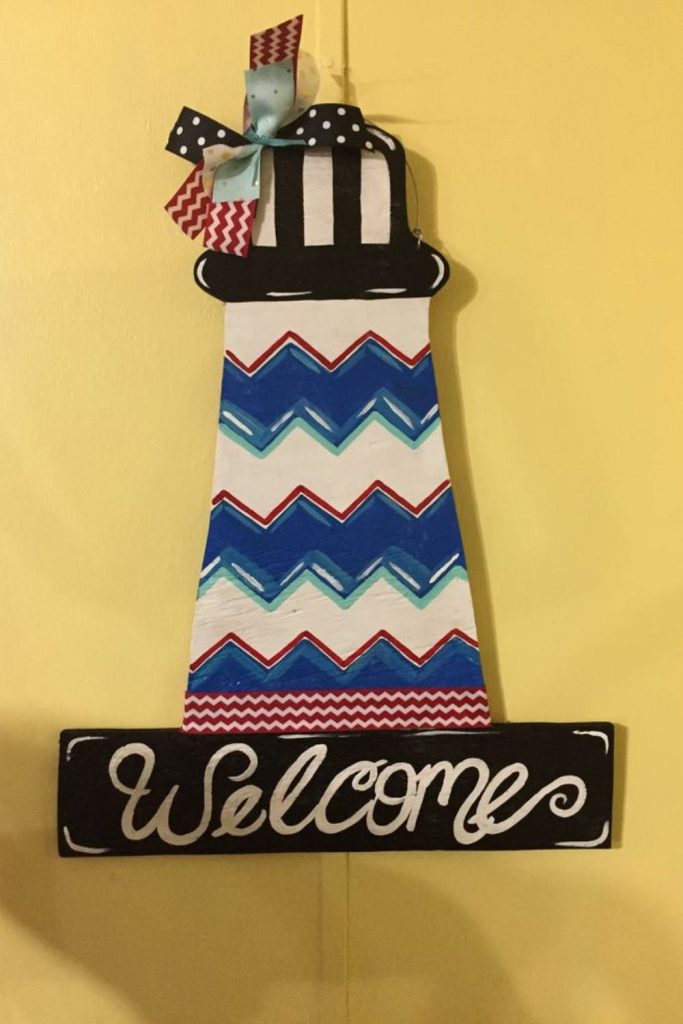Lighthouse with patriotic coastal decorations.