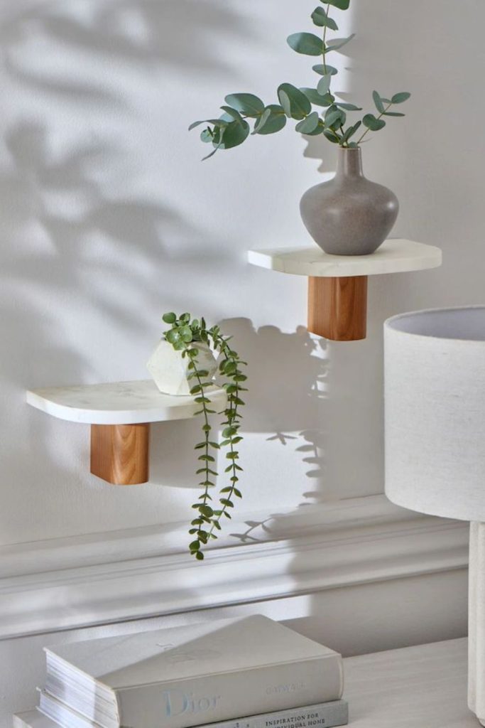 Marble accents creating luxurious shelves.