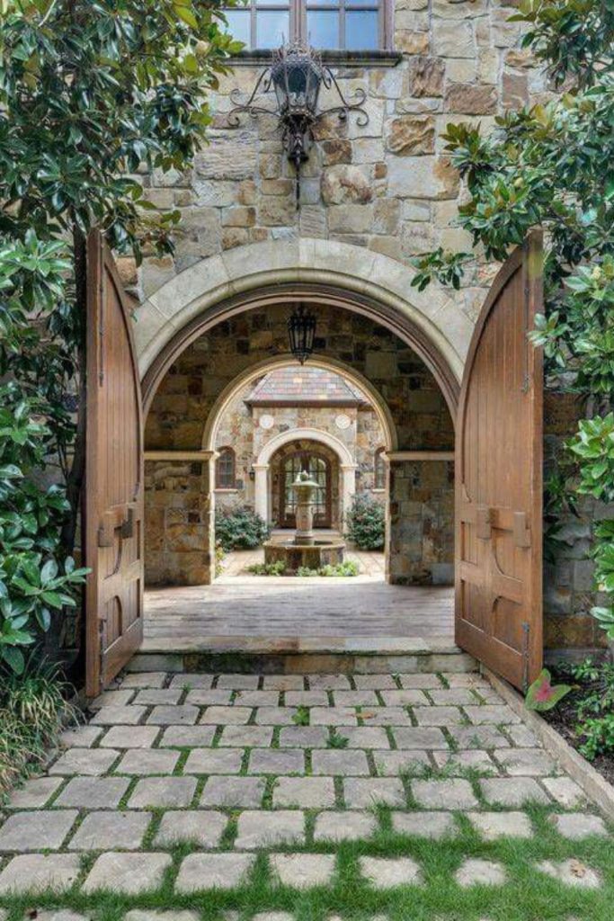 Arched stone Mediterranean elegant villa entrance gate