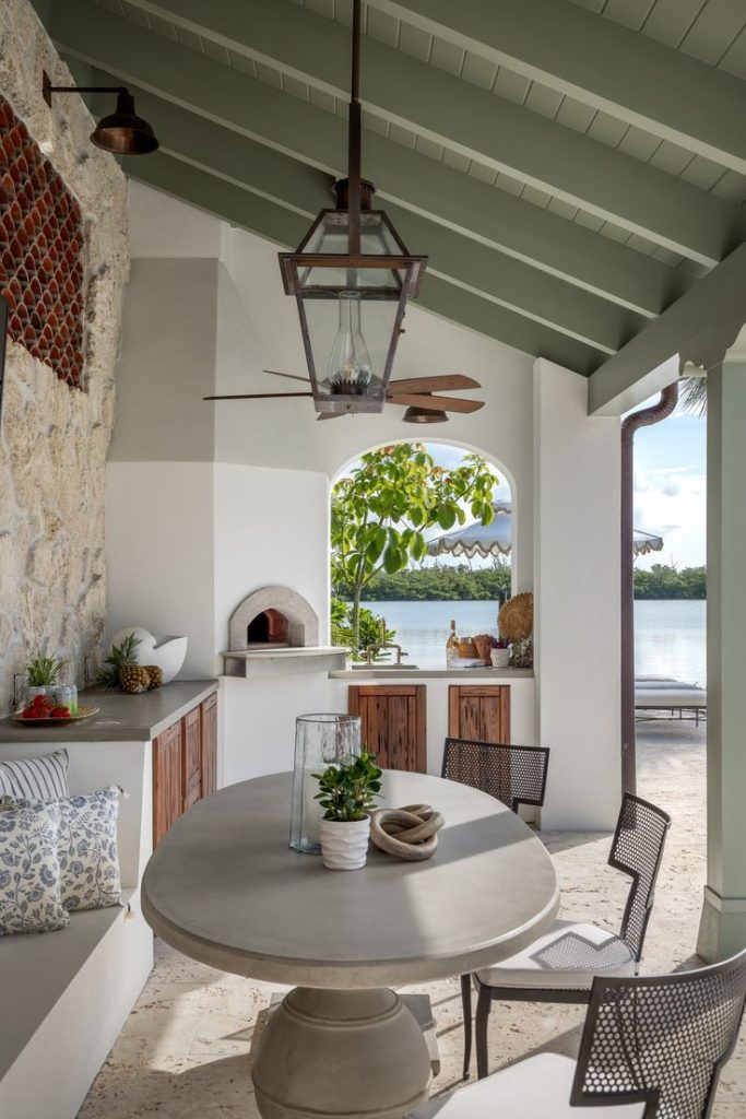 Mediterranean outdoor kitchen with terracotta roof.