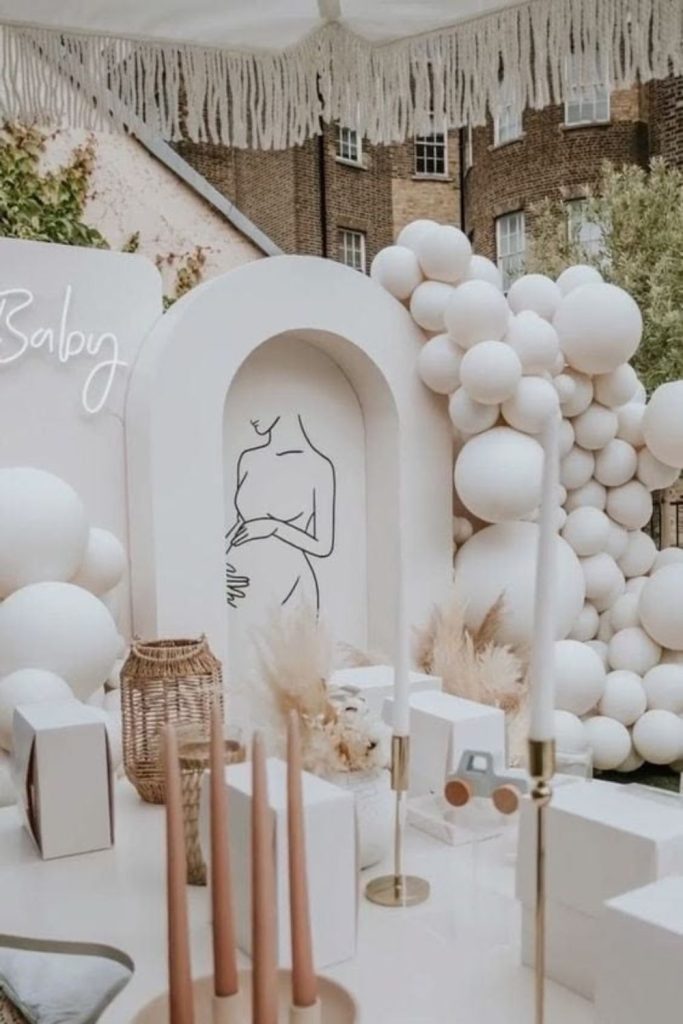Minimalist modern baby shower decor setup.