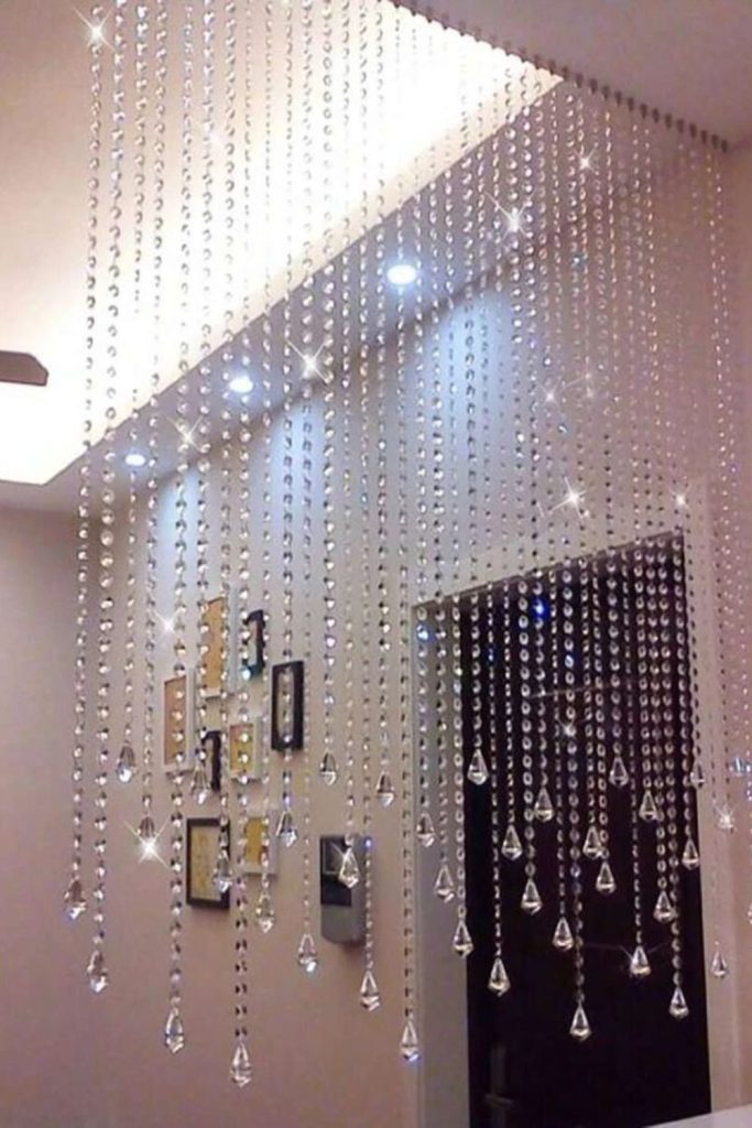 Moonlit crystal strands sparkling across wall.