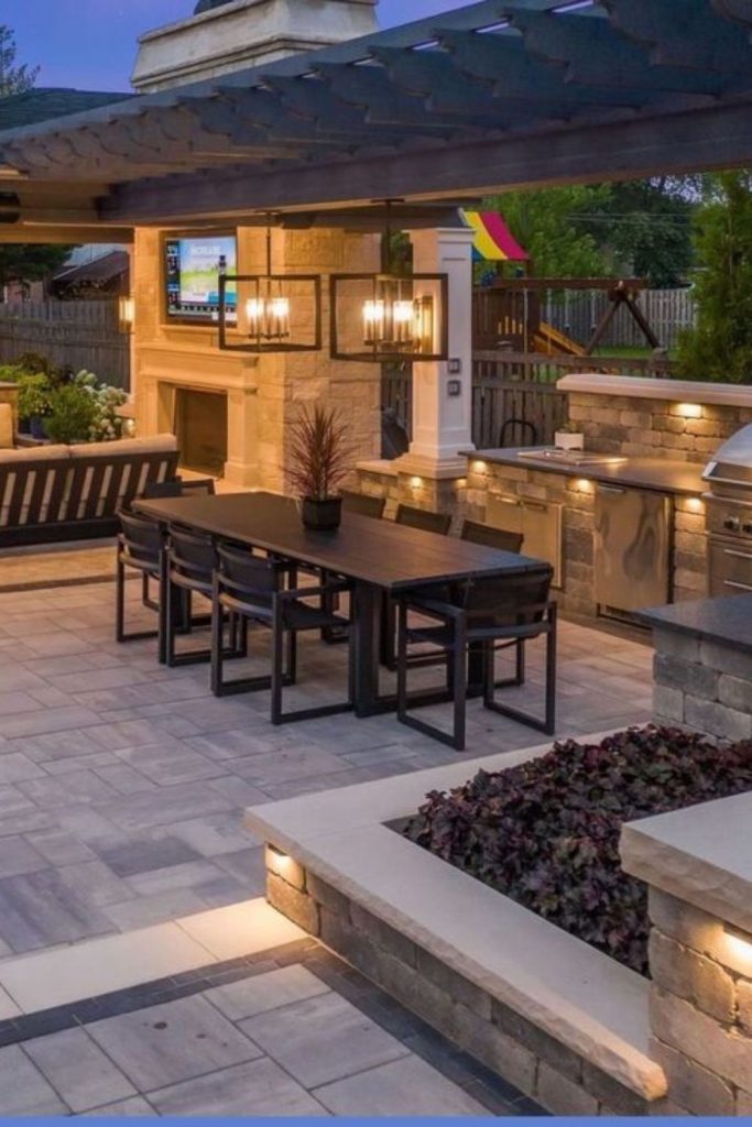 Moonlit garden covered outdoor kitchen lodge.