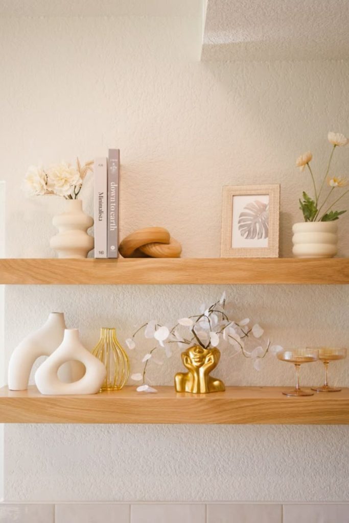 Neutral toned serene shelf styling.