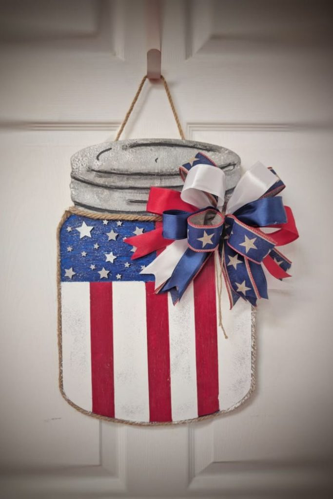 Mason jar bouquet patriotic door hanger.