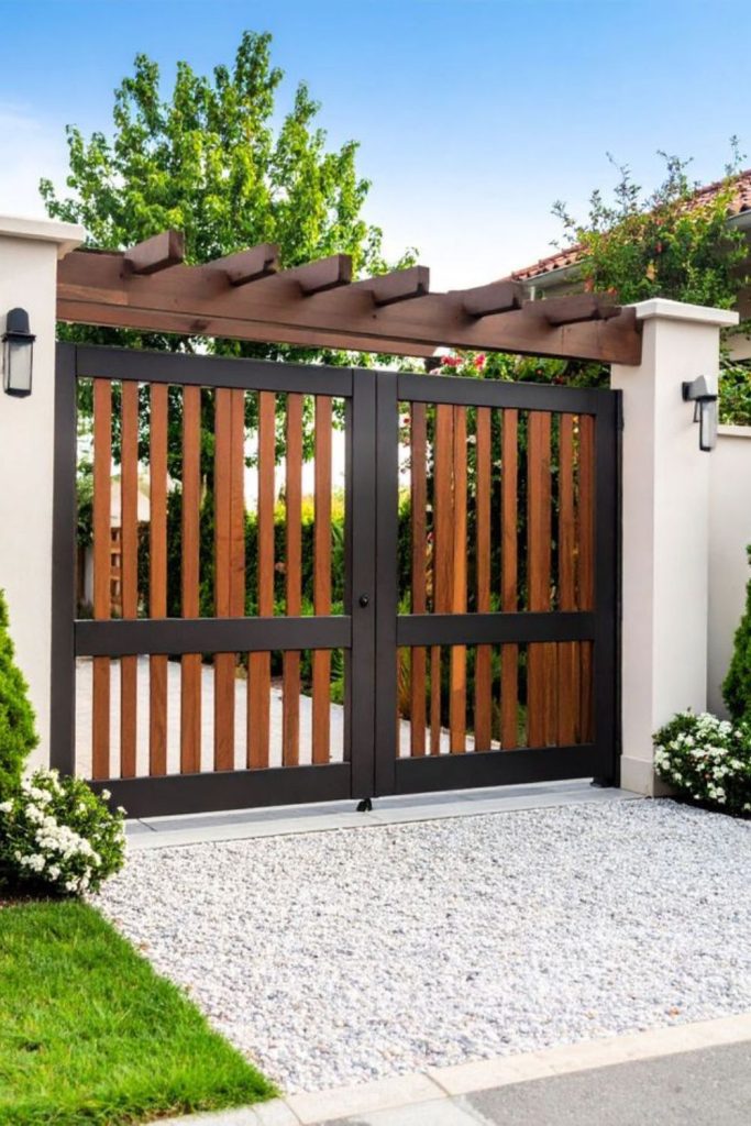 Rustic metal arched farm entrance gate