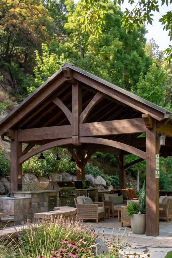 Timber lodge outdoor kitchen with beams.