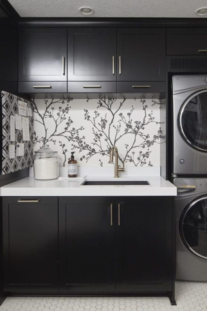 Black and white laundry cabinets.