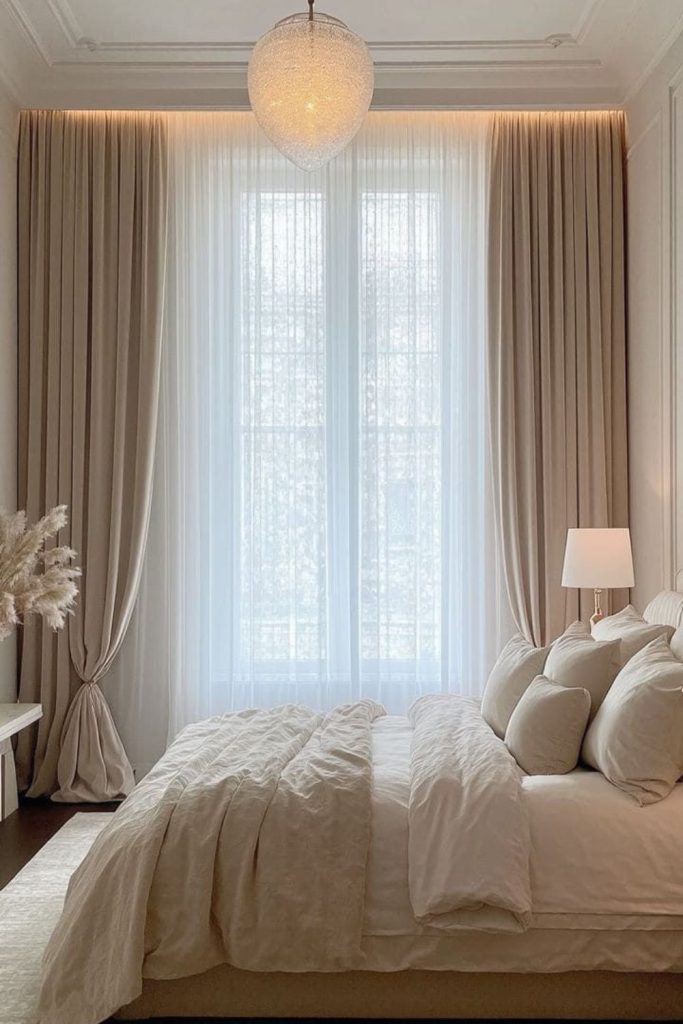 Champagne silk curtains with cellular blinds.