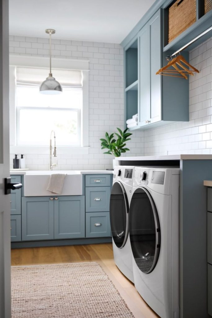 Coastal blue laundry room cabinetry.