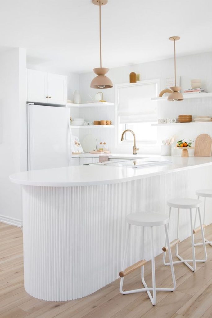 Cottage white kitchen island with wood.