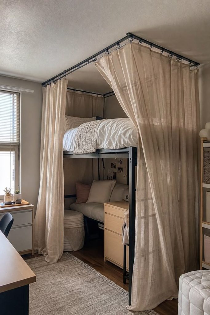 Cozy curtain hideaway beneath lofted bed.