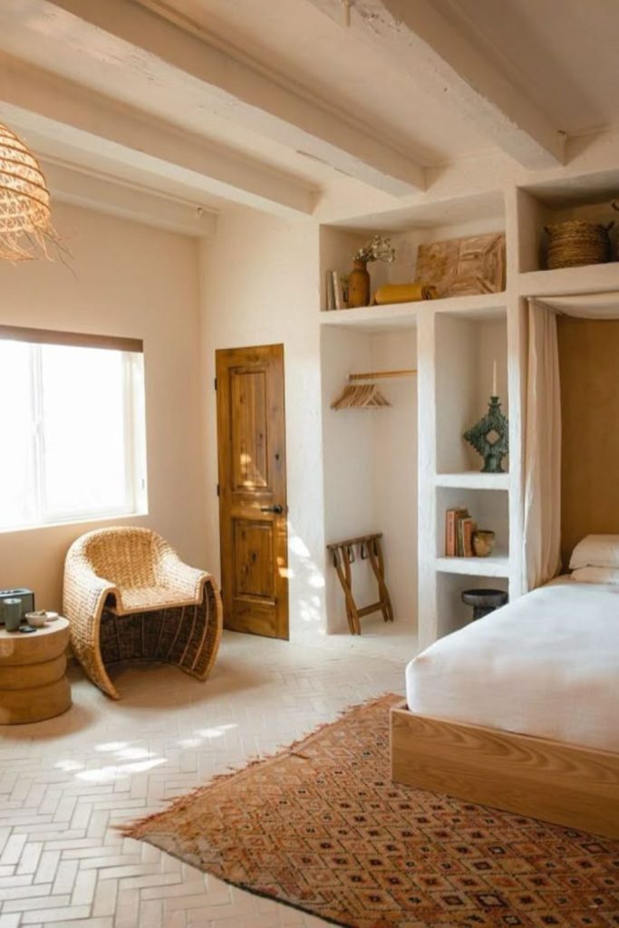 Terracotta accents beside curved neutral furniture.