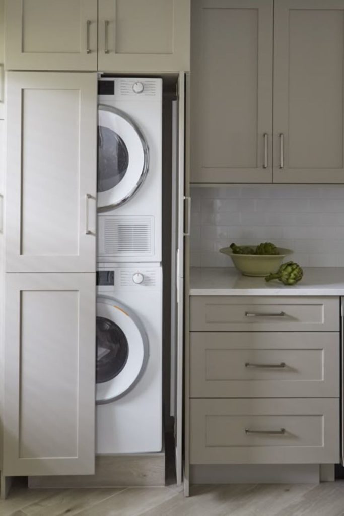 Hidden appliance laundry room cabinets.