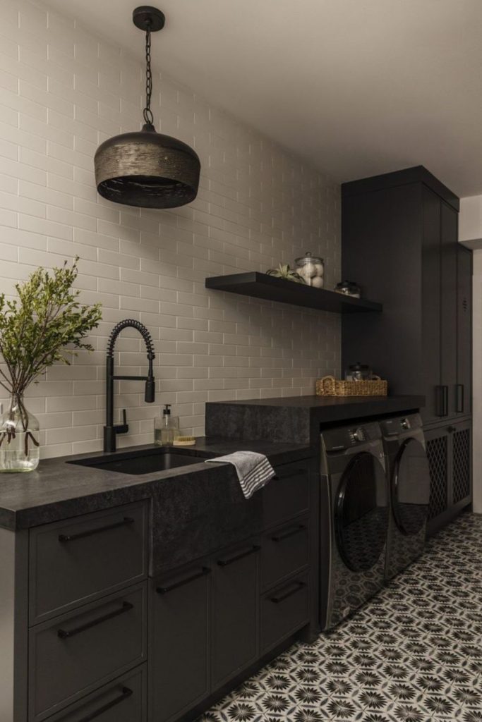 Matte black luxury laundry cabinets.