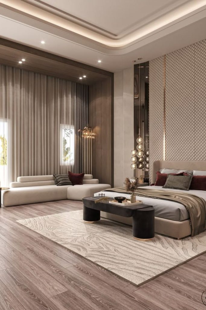Upholstered headboard with layered plush bedding.