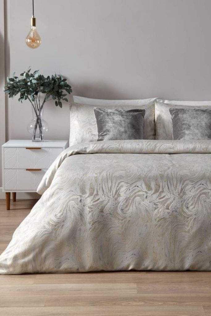 Marble print bedding with modern decor.