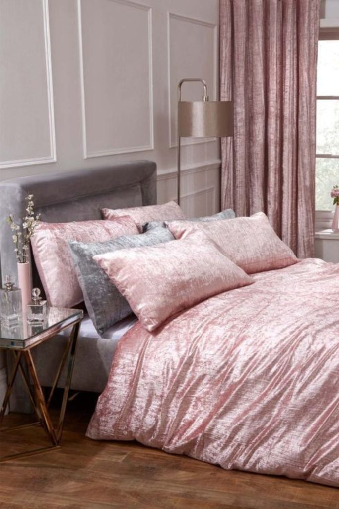 Luxurious pink velvet grey bedroom design.