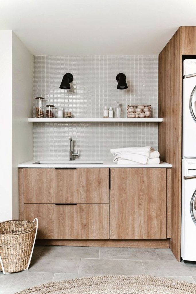 Scandinavian minimalist laundry room cabinets.