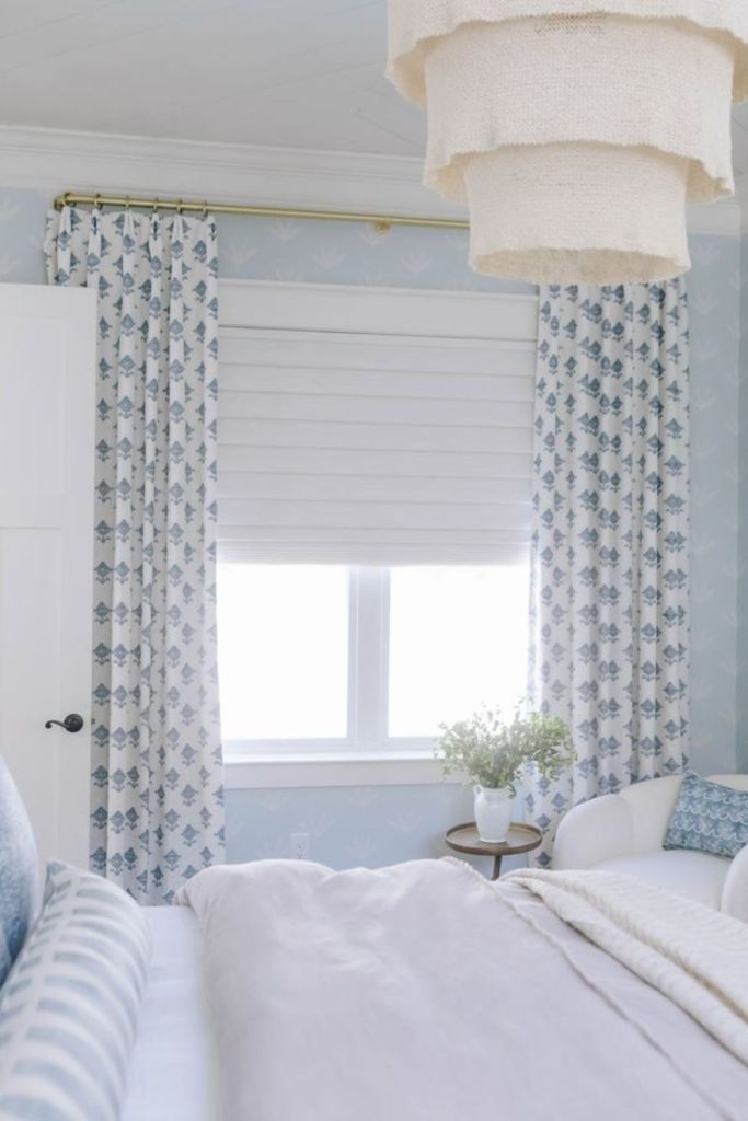 Blue coastal curtains with woven blinds.