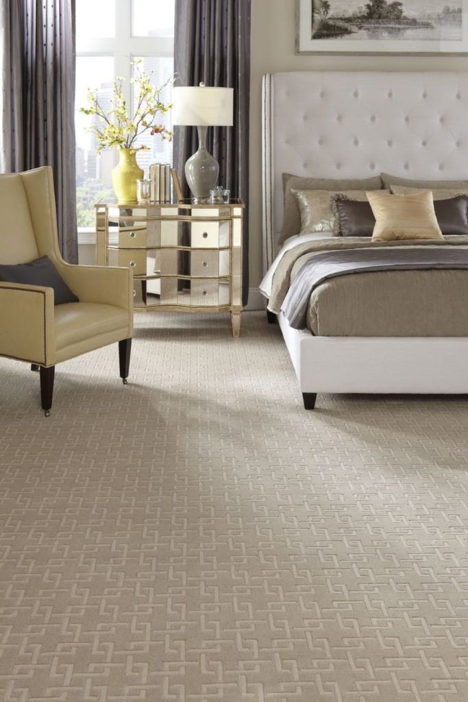 Soft taupe neutral bedroom carpet design.