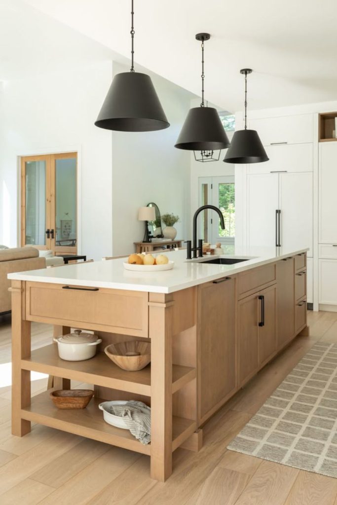 Warm oak kitchen island with sink.