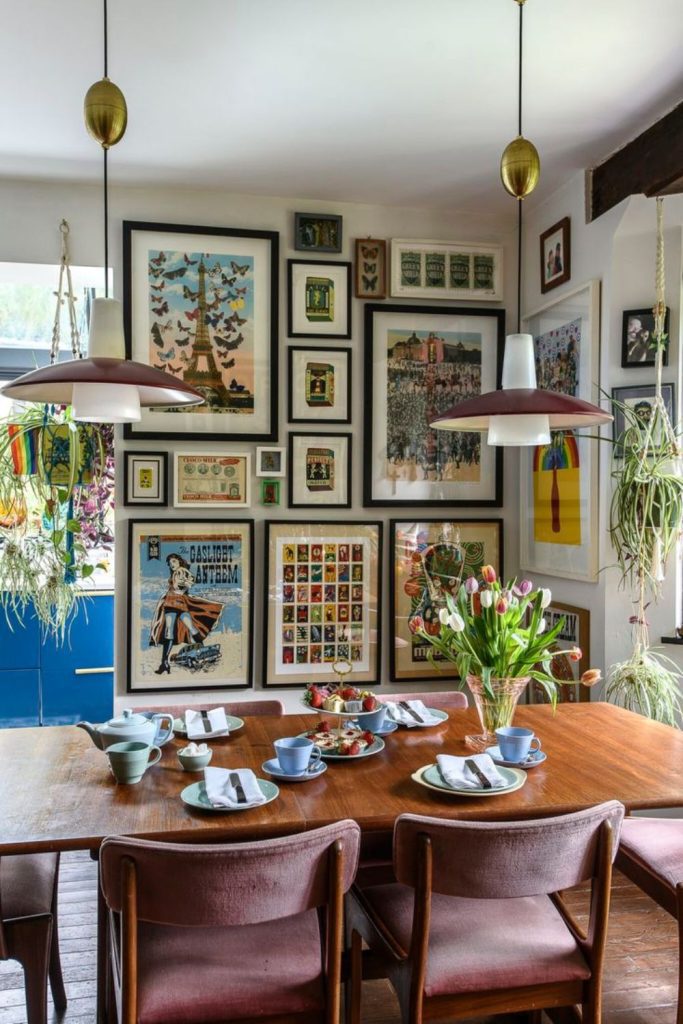 Artistic dining room featuring gallery wall.