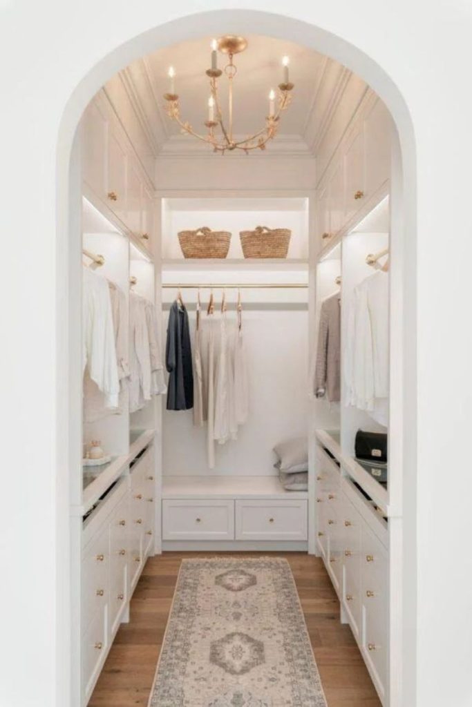 Bright white walk-in wardrobe design.