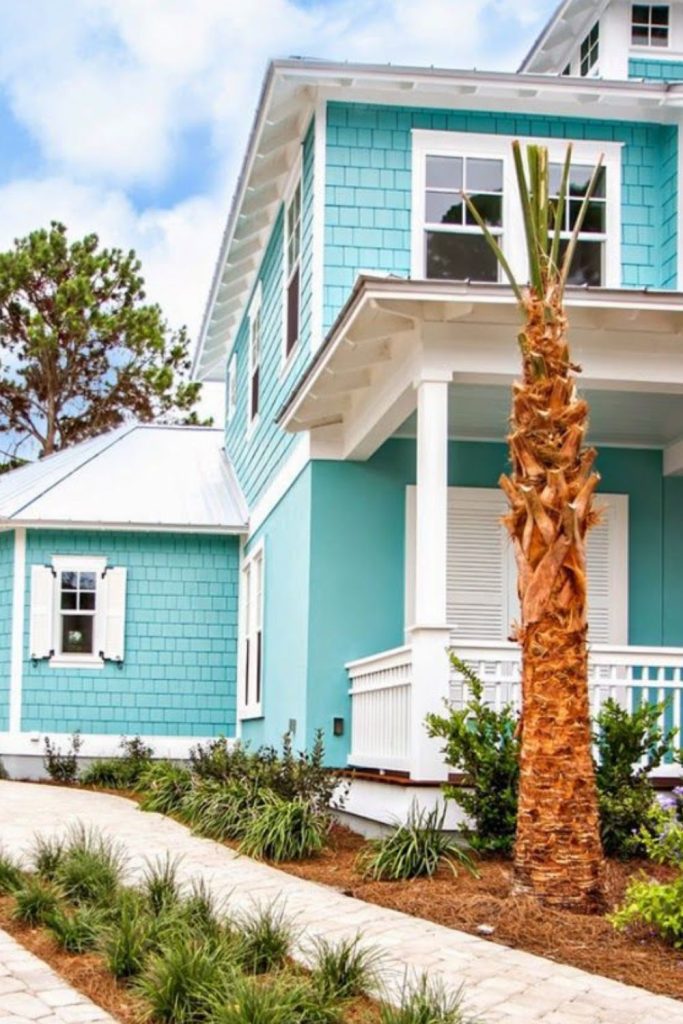 Coastal teal exterior with sand white.