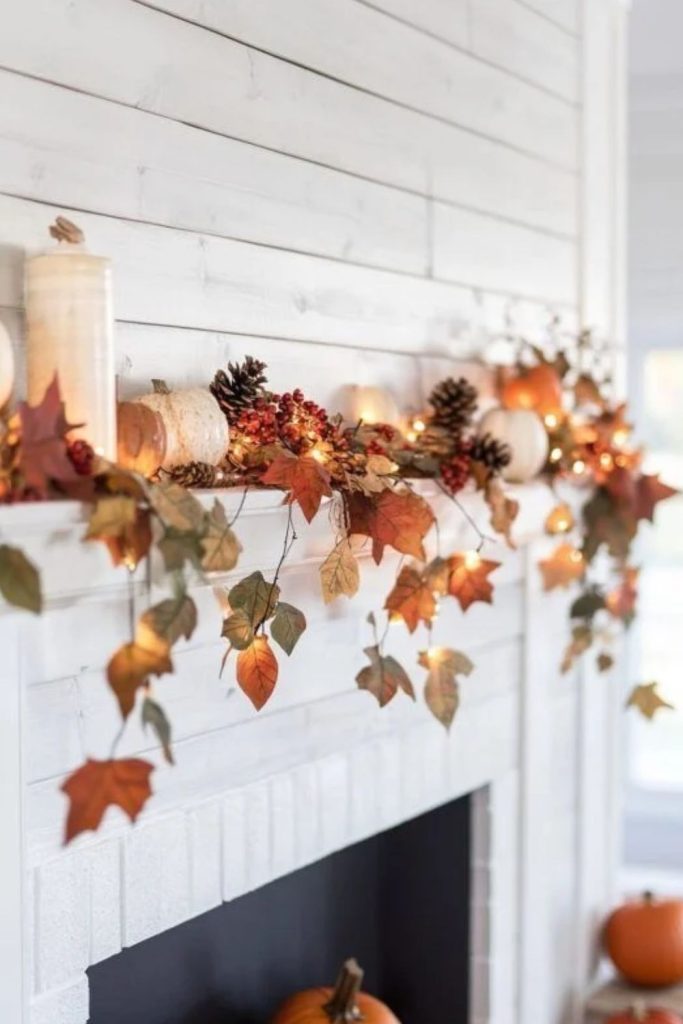 Dried leaf garland across a fall mantel.