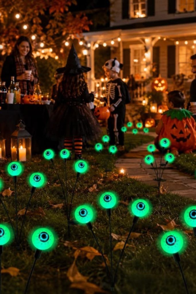Glowing eyeballs scattered throughout Halloween garden.