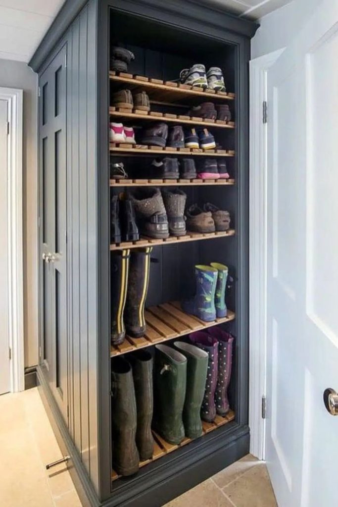 Hidden boot storage wall with cabinetry.