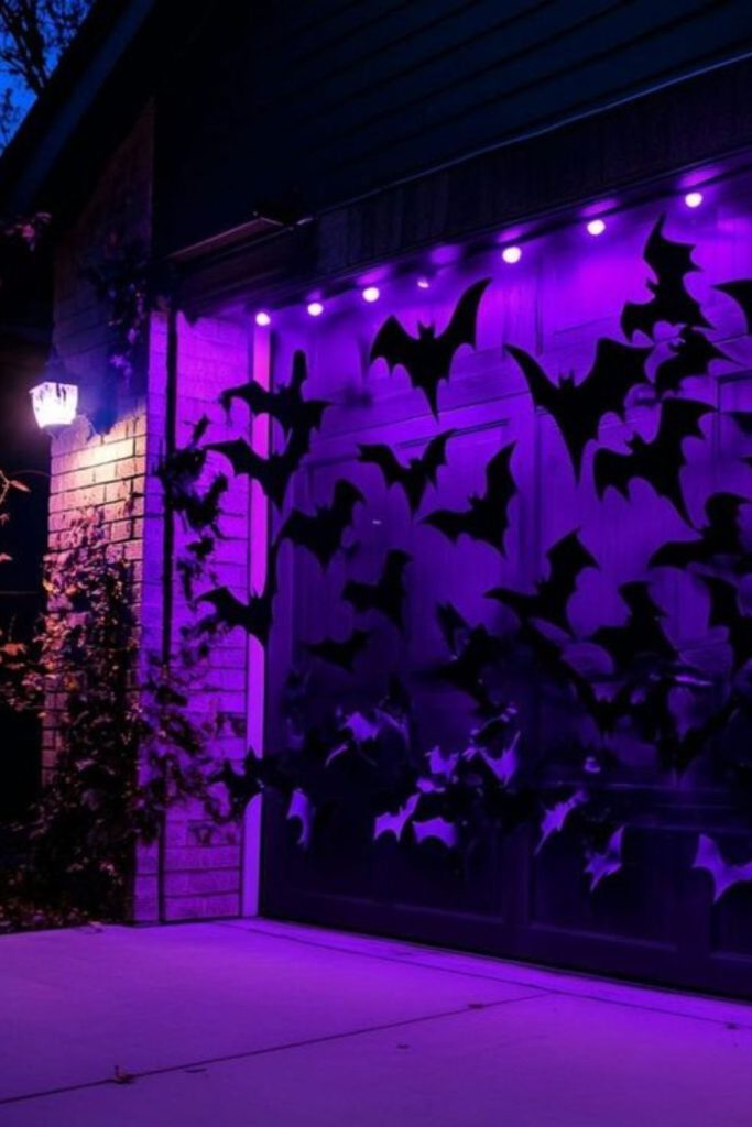 Flying bats covering Halloween porch ceiling.